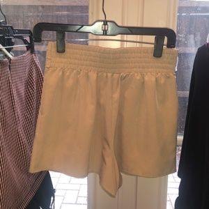 tan shorts, small, elastic waistband